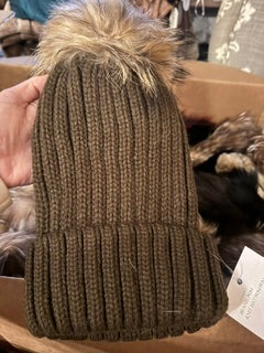 Brown knit hat with pom pom
