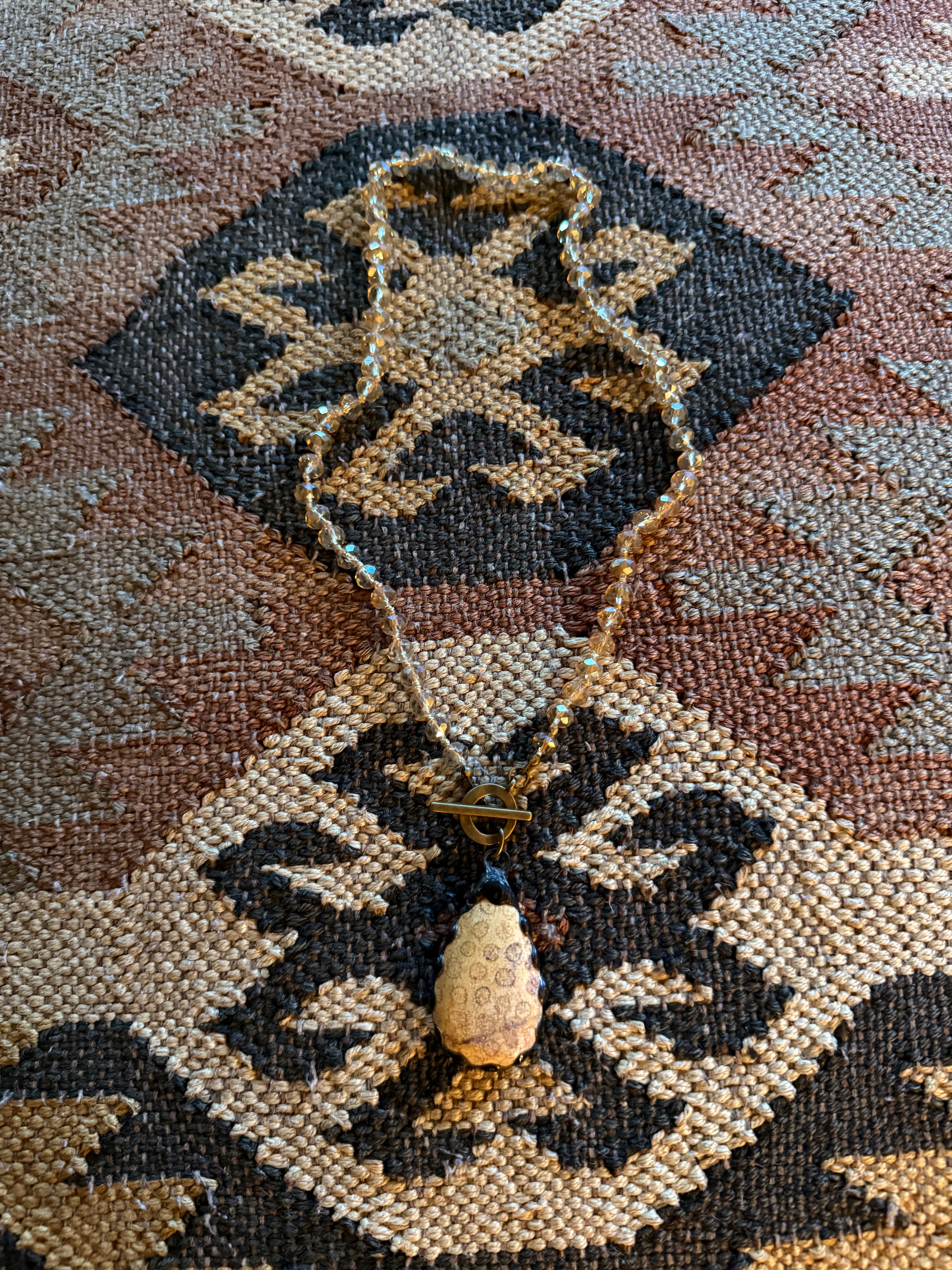 Carved Bone Pendant Necklace with Amber Glass Beads on a Brass Chain