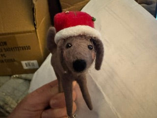 Brown wool dog w/long red santa hat ornament