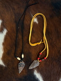 Arrowhead Necklace Adorned with Beads on a Leather Strap