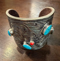 Sterling Silver Carved Cuff Bracelet Adorned with Turquoise and Coral Stones