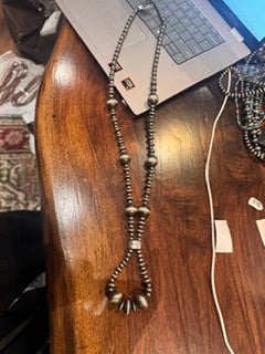 Long navajo pearls with oval at the bottom