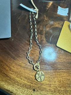 Mixed Metals with a cross pendant with a diamond